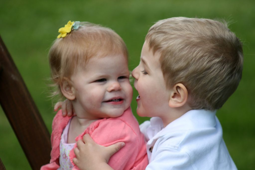 He has moved on from trying to strangle his sister to trying to now eat her. Excellent