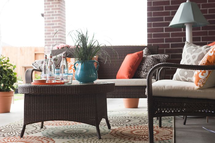 Not quite the color scheme I had in mind, but I love the way the pillows pop out the rug color in this design from Family Friendly Home