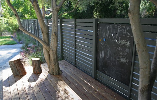 For endless hours of artsy fun, convert a section of your fence into a chalkboard. As a great weekend DIY project, follow these steps and you're set!