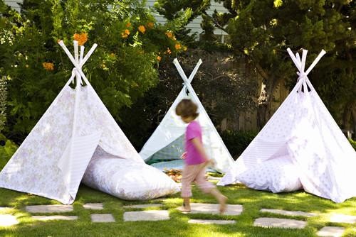For cool shade during the day and starry slumber at night, try building forts and teepees. Since children love little hideaways and spaces they can call their own, miniature camps like these are sure to be a hit. Invite a few friends over, build a fire and roast marshmallows for a slumber party they will never forget.
