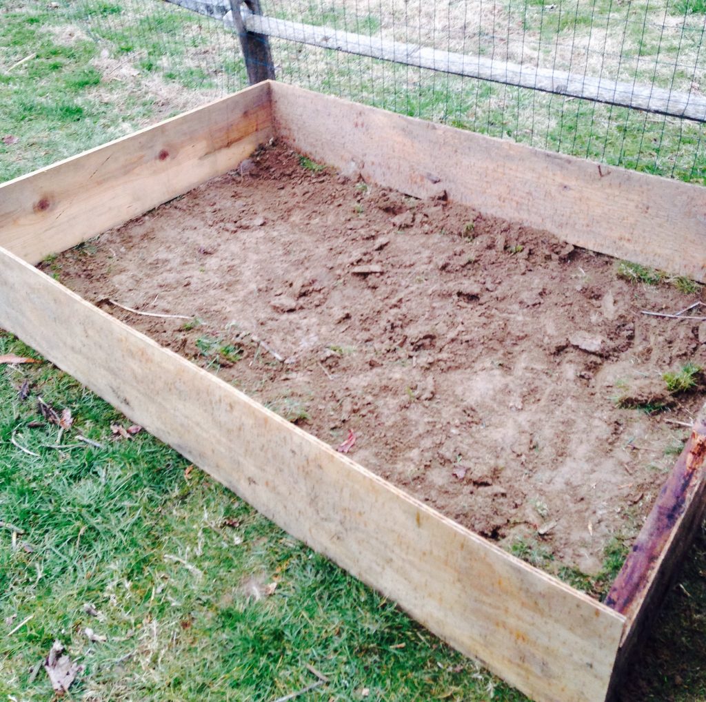 Wanting to build a raised garden bed for your home vegetable garden, but aren't sure where to start? Here is the easy step-by-by step how-to guide to build your own--the very cheap, economical way! Take an afternoon and get ready to dig into your own fresh, home-grown produce with these easy steps!