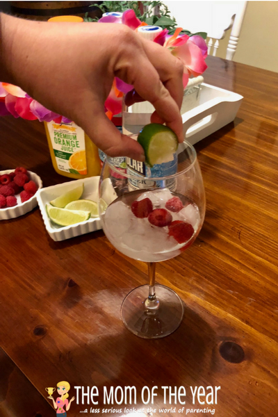 Dreaming of kick-back beach days? Bring the vacation to you with this INCREDIBLE cocktail recipe for a Raspberry Lime Coconut Crusher! It's dreamy, drool-worthy and the perfect summer escape you need--all in one delicious drink that will whisk you away, mama!