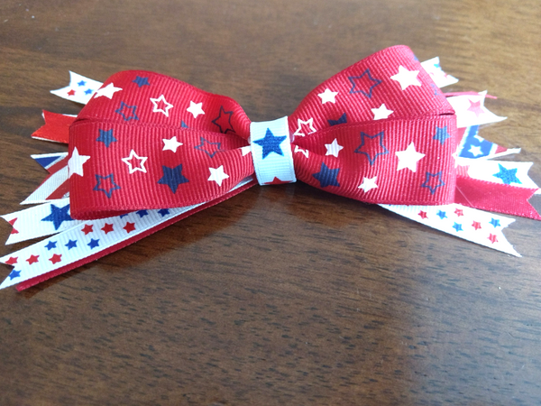 DIY Patriotic Bows are the PERFECT way to get your little gal in the Americana spirit for Memorial Day or July 4th! You'll be surprised at how easy these are to whip up! Save a ton of money making your own vs. purchasing store-bought, and these make a super gift too! And MAKE SURE to catch the smart tips at the end about what mistakes to avoid for better results!