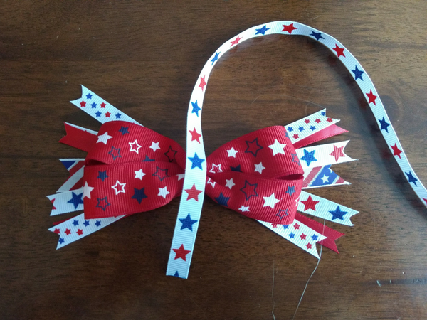 DIY Patriotic Bows are the PERFECT way to get your little gal in the Americana spirit for Memorial Day or July 4th! You'll be surprised at how easy these are to whip up! Save a ton of money making your own vs. purchasing store-bought, and these make a super gift too! And MAKE SURE to catch the smart tips at the end about what mistakes to avoid for better results!