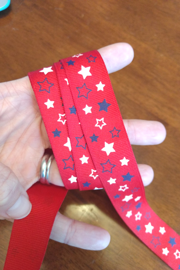 DIY Patriotic Bows are the PERFECT way to get your little gal in the Americana spirit for Memorial Day or July 4th! You'll be surprised at how easy these are to whip up! Save a ton of money making your own vs. purchasing store-bought, and these make a super gift too! And MAKE SURE to catch the smart tips at the end about what mistakes to avoid for better results!